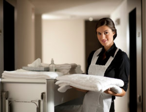 maid holding clean towels